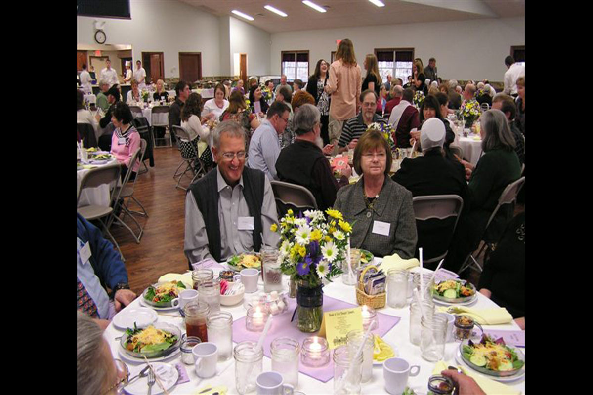 Getting together after work at a seasonal employee recognition dinner means lots of smiles and good food.