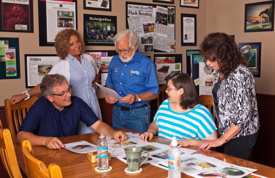 Jay Lehman working with staff at company headquarters in Dalton, OH, just a few miles north of the retail store in Kidron, OH.